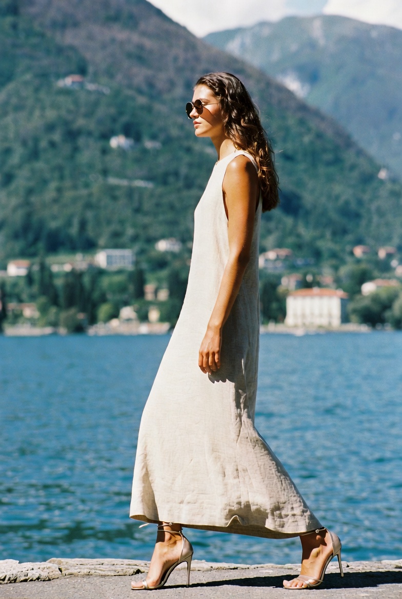 A woman in a long neutral linen dress at Lake Como, ESVRA Power of Linen edit
