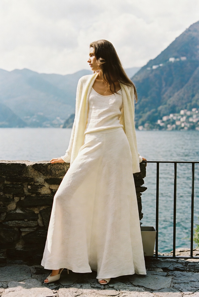 A woman in a long linen skirt at Lake Como, ESVRA Power of Linen edit
